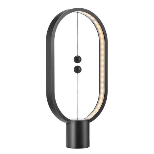 Stylish magnetic lamp illuminating a cozy room"

"Contemporary desk lamp with warm LED glow"

"Balance lamp with ellipse frame and suspended magnetic switch"

"Magnetic LED table light perfect for bedroom or office"

Futuristic LED ellipse lamp with interactive magnetic design
Elegant bedside lamp with balance-inspired magnetic lighting