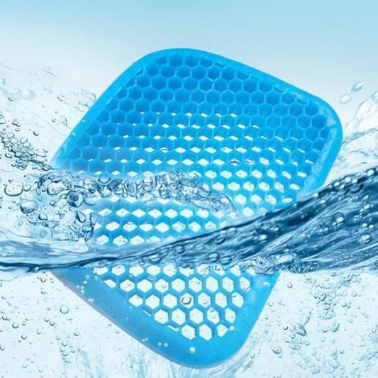 Elastic silicone egg seat cushion on a chair"

"Blue silicone cushion with honeycomb design"

"Seat cushion showing flexible and breathable material"

"Cushion compressed with hand to show softness"
Cushion supporting an egg without breaking