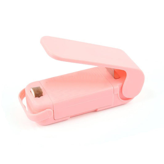 "Mini portable plastic sealer sealing a snack bag"

"Compact bag sealer in hand, easy to use"

"Handheld plastic sealer on kitchen counter"

"Close-up of mini sealer sealing a food pouch"

"Small heat sealer for plastic bags