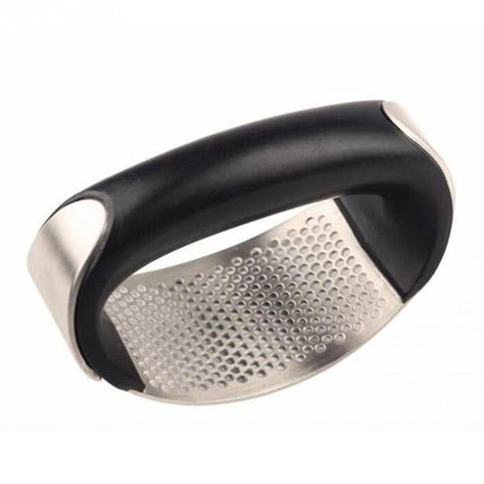 Garlic crusher with fresh minced garlic"

"Hand pressing garlic with stainless steel crusher"

"Easy-to-clean garlic crusher tool"

"Durable stainless garlic press for home cooking"

Modern kitchen tool for crushing garlic cloves
Garlic press with non-slip grip handle
Compact stainless steel garlic crusher in use